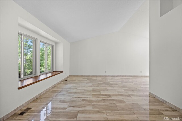 8725 Meadowlark Cir, Highlands Ranch, CO 80126 - unfurnished room featuring baseboards and high vaulted ceiling