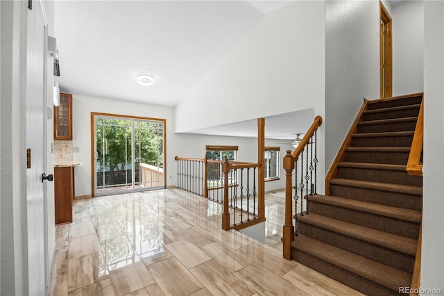 8725 Meadowlark Cir, Highlands Ranch, CO 80126 - entrance foyer with high vaulted ceiling and baseboards