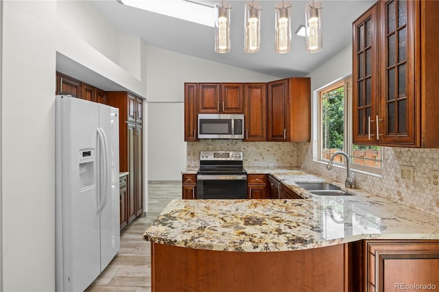 8725 Meadowlark Cir, Highlands Ranch, CO 80126 - kitchen with stainless steel appliances, a peninsula, vaulted ceiling, light stone counters, and decorative backsplash