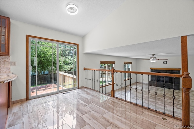 8725 Meadowlark Cir, Highlands Ranch, CO 80126 - unfurnished room with a ceiling fan, lofted ceiling, and marble finish flooring