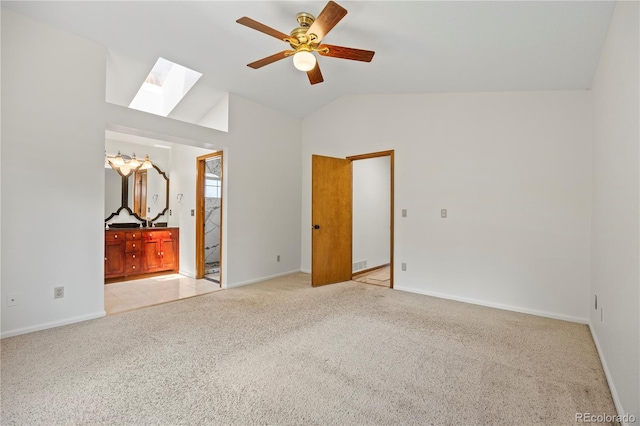 8725 Meadowlark Cir, Highlands Ranch, CO 80126 - unfurnished bedroom featuring a skylight, light carpet, lofted ceiling, ensuite bathroom, and ceiling fan