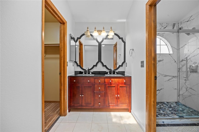 8725 Meadowlark Cir, Highlands Ranch, CO 80126 - bathroom featuring a marble finish shower, double vanity, and tile patterned floors