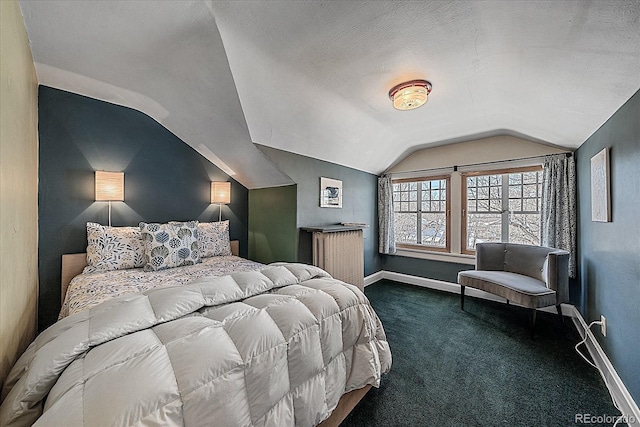 carpeted bedroom featuring lofted ceiling