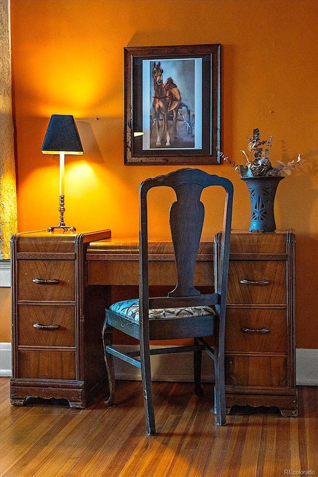 sitting room with wood-type flooring