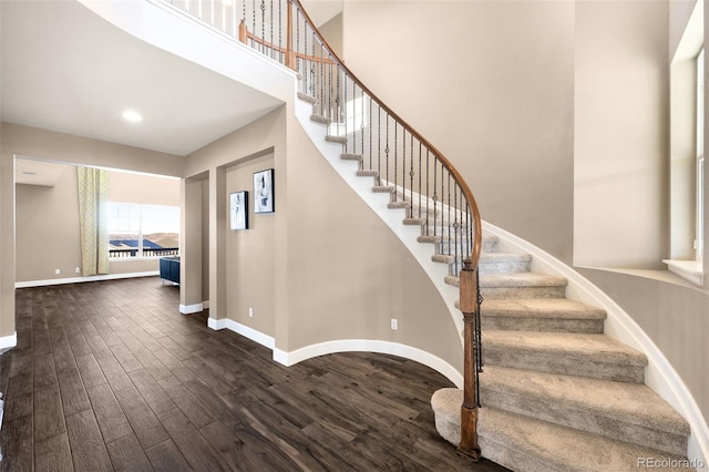 staircase featuring hardwood / wood-style flooring