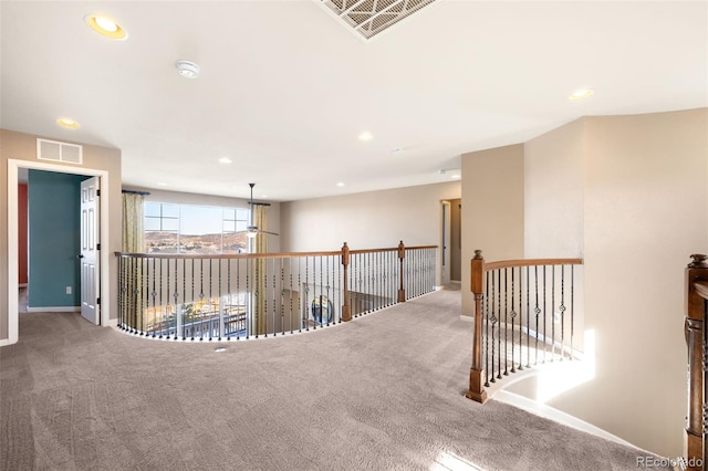 hallway with carpet flooring