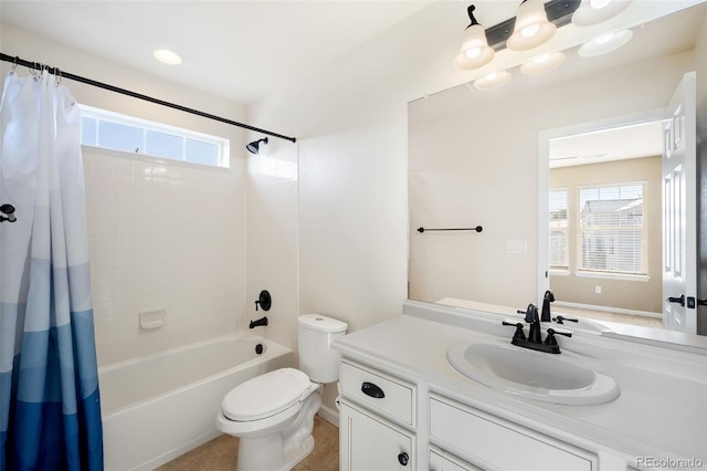 full bathroom with shower / bath combination with curtain, vanity, and toilet