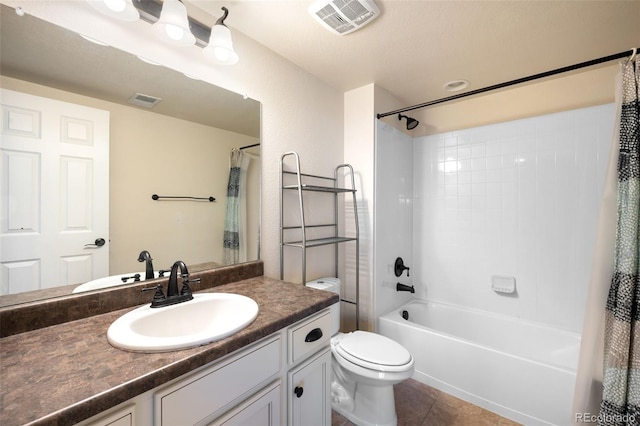 full bathroom featuring tile patterned floors, vanity, toilet, and shower / tub combo with curtain