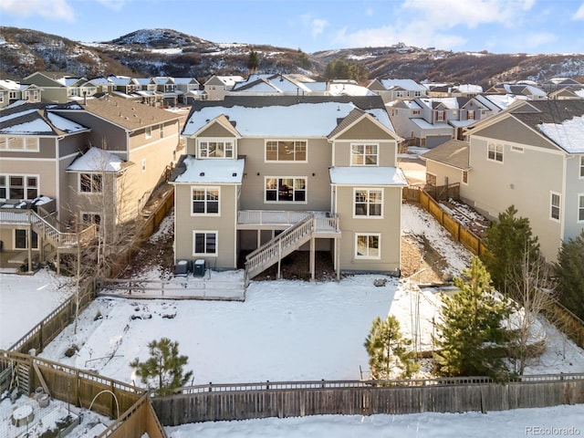 snowy aerial view featuring a mountain view