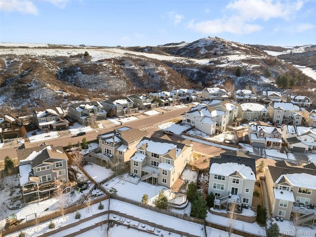 snowy aerial view with a mountain view