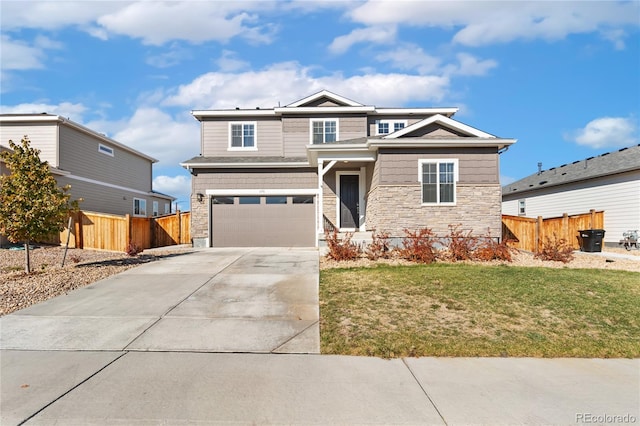 view of front of property featuring a garage and a front lawn