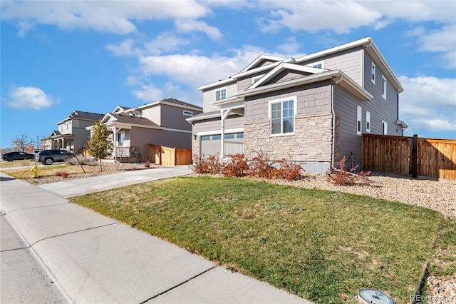 view of front of house featuring a front lawn and a garage