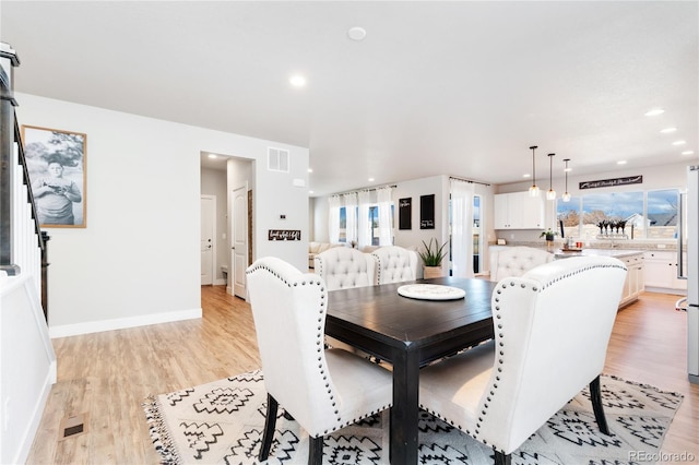 dining room featuring light hardwood / wood-style flooring