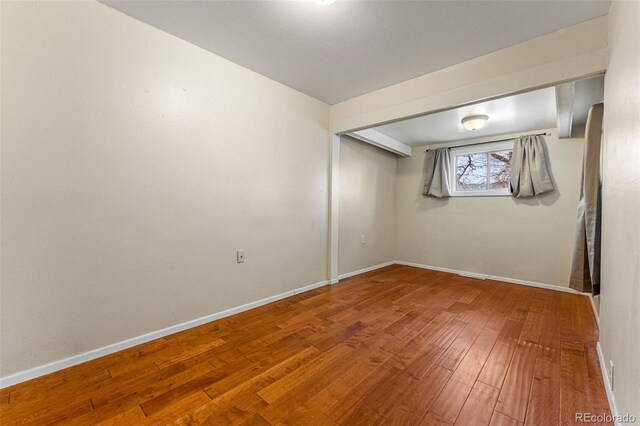 2515 Ames St, Edgewater, CO 80214 - basement featuring hardwood / wood-style floors and baseboards