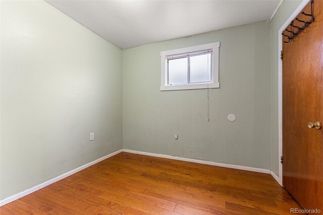 2515 Ames St, Edgewater, CO 80214 - unfurnished bedroom featuring wood finished floors and baseboards