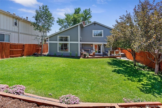 7968 S Trenton St, Centennial, CO 80112 - rear view of property featuring a fenced backyard and a wooden deck