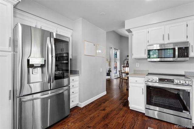 7968 S Trenton St, Centennial, CO 80112 - kitchen with appliances with stainless steel finishes, dark wood-style flooring, and white cabinetry