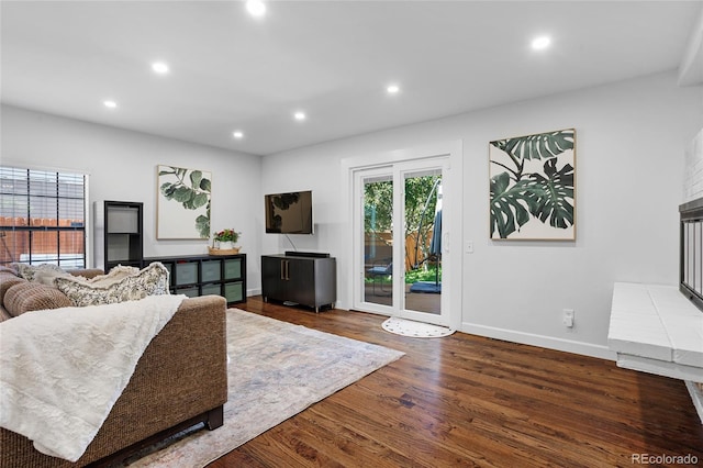 7968 S Trenton St, Centennial, CO 80112 - living area with recessed lighting, wood finished floors, and a fireplace