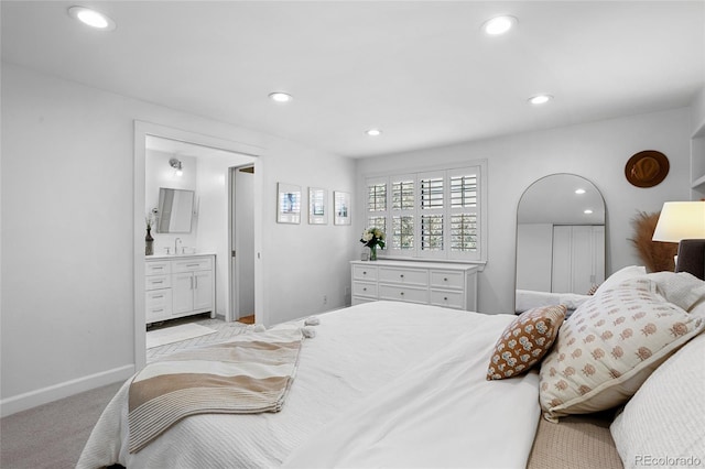 7968 S Trenton St, Centennial, CO 80112 - bedroom with light carpet, recessed lighting, and ensuite bathroom