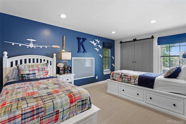 7968 S Trenton St, Centennial, CO 80112 - bedroom with light colored carpet, recessed lighting, and a barn door