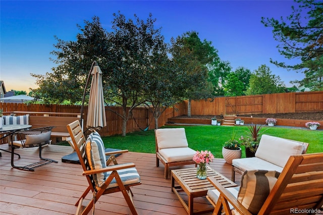 7968 S Trenton St, Centennial, CO 80112 - deck at dusk with a fenced backyard and an outdoor living space