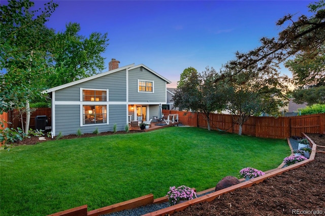 7968 S Trenton St, Centennial, CO 80112 - rear view of property with a fenced backyard, a chimney, and a patio area