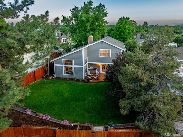 7968 S Trenton St, Centennial, CO 80112 - rear view of property with a fenced backyard and a chimney