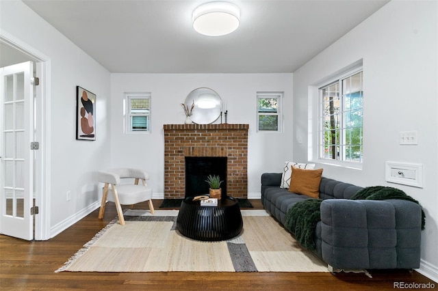 4003 Federal Blvd, Denver, CO 80211 - living area with wood finished floors, healthy amount of natural light, a fireplace, and baseboards