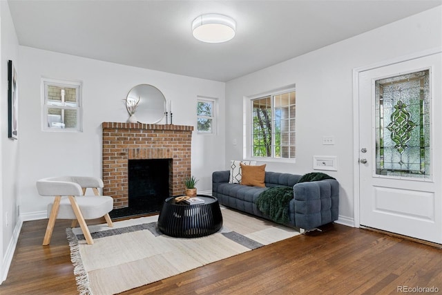 4003 Federal Blvd, Denver, CO 80211 - living room with dark wood-style flooring, baseboards, and a fireplace