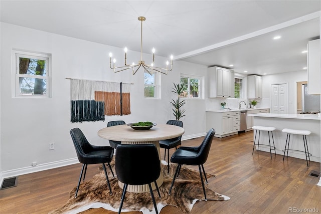 4003 Federal Blvd, Denver, CO 80211 - dining space with dark wood-style flooring, a chandelier, recessed lighting, and baseboards