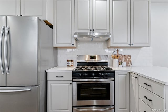 4003 Federal Blvd, Denver, CO 80211 - kitchen featuring appliances with stainless steel finishes, under cabinet range hood, white cabinets, and decorative backsplash