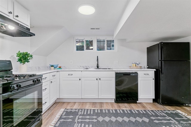 4003 Federal Blvd, Denver, CO 80211 - kitchen featuring black appliances, a sink, under cabinet range hood, light wood-style flooring, and white cabinetry