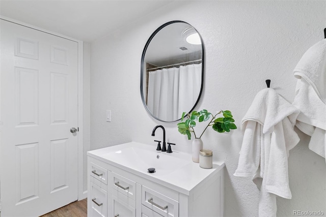 4003 Federal Blvd, Denver, CO 80211 - full bath featuring vanity and wood finished floors