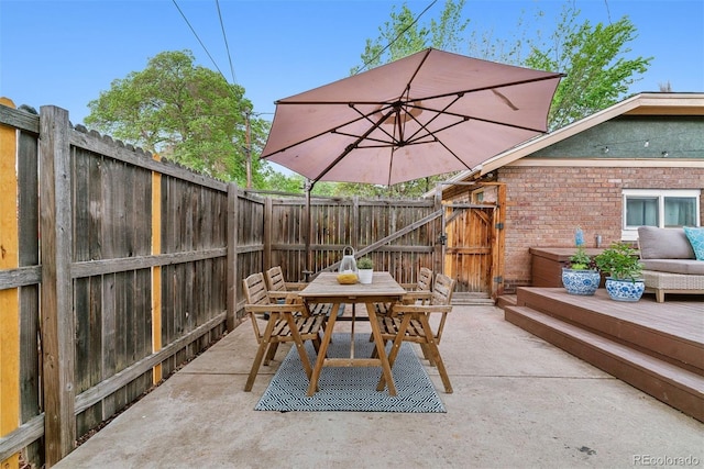4003 Federal Blvd, Denver, CO 80211 - view of patio / terrace featuring outdoor dining area, a fenced backyard, and a gate
