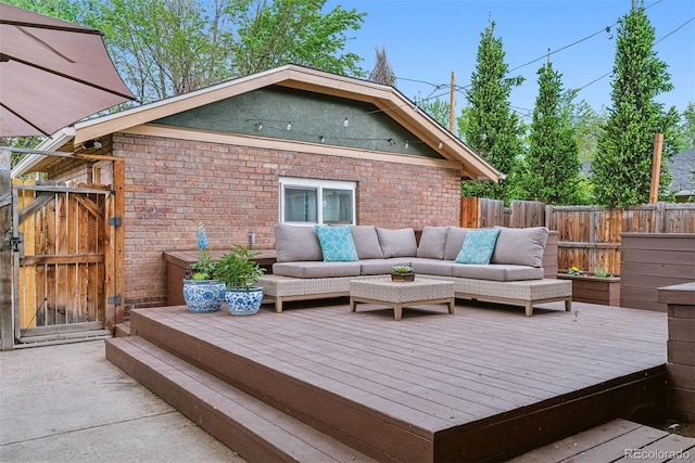 4003 Federal Blvd, Denver, CO 80211 - wooden terrace featuring an outdoor hangout area, a gate, and a fenced backyard