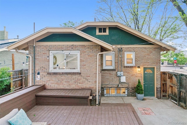 4003 Federal Blvd, Denver, CO 80211 - back of property featuring a wooden deck, fence, and brick siding
