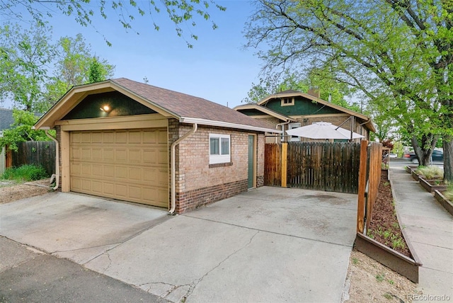4003 Federal Blvd, Denver, CO 80211 - garage featuring fence and driveway