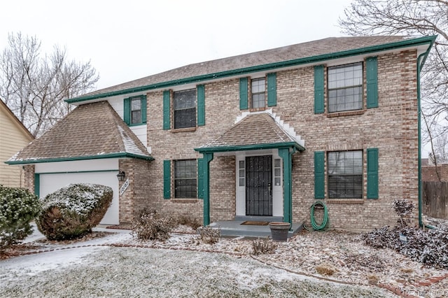 view of front of property with a garage