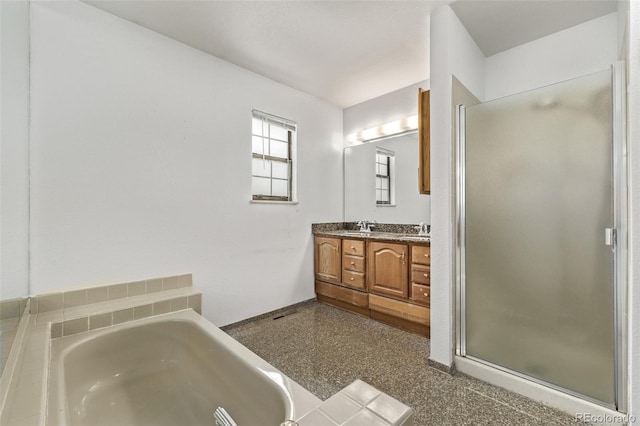 bathroom featuring separate shower and tub and vanity