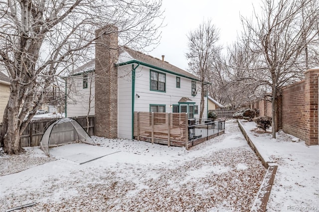 view of snow covered house