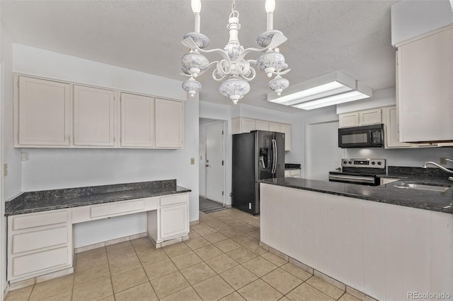 kitchen with built in desk, a chandelier, a sink, appliances with stainless steel finishes, and light tile patterned floors