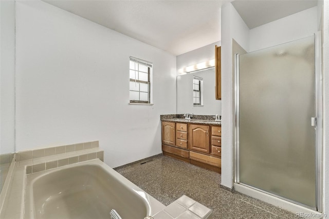 full bathroom with a sink, double vanity, a stall shower, and a bath