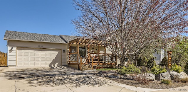 1141 Beech St, Fort Lupton, CO 80621 - view of front facade with driveway, an attached garage, a pergola, and roof with shingles