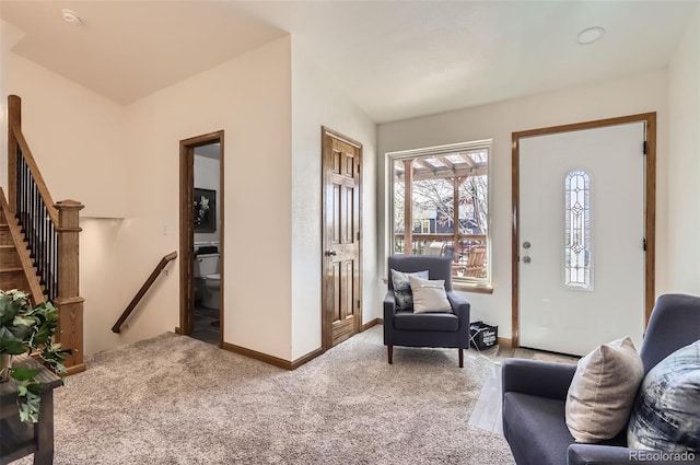1141 Beech St, Fort Lupton, CO 80621 - entrance foyer with carpet floors, stairway, and baseboards