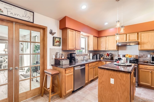 1141 Beech St, Fort Lupton, CO 80621 - kitchen featuring appliances with stainless steel finishes, under cabinet range hood, a sink, tasteful backsplash, and a kitchen island