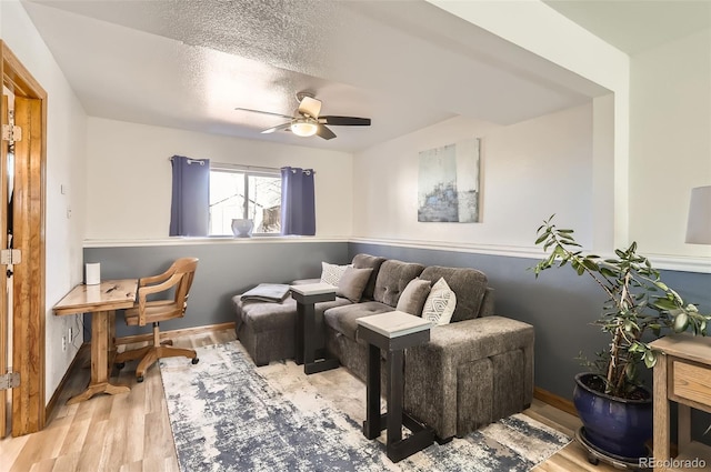 1141 Beech St, Fort Lupton, CO 80621 - living room featuring ceiling fan, wood finished floors, and baseboards