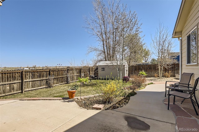1141 Beech St, Fort Lupton, CO 80621 - fenced backyard featuring a patio area and an outdoor structure