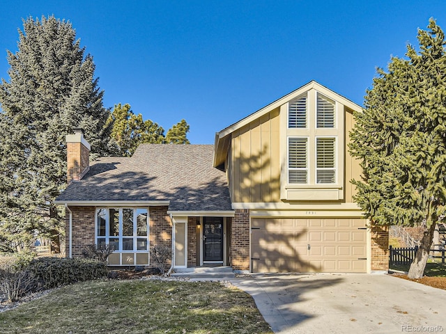 view of front of property featuring a garage and a front lawn