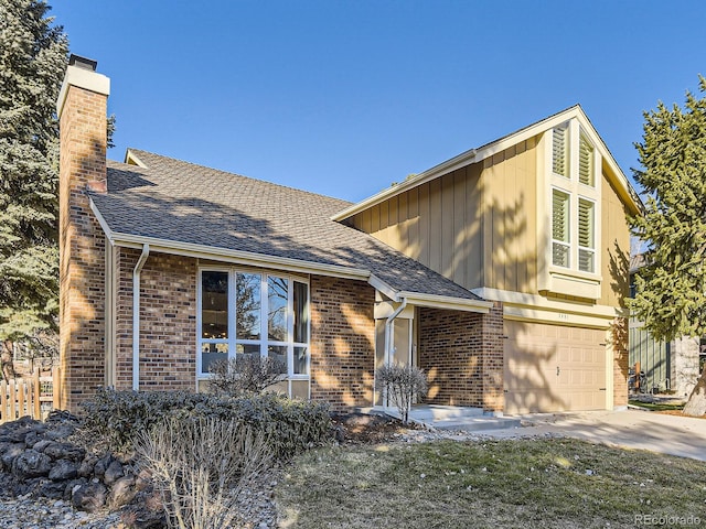 view of front of property featuring a garage and a front yard