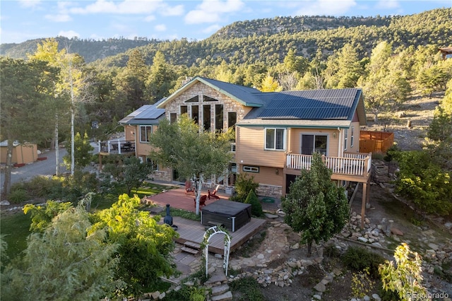 rear view of house with a deck